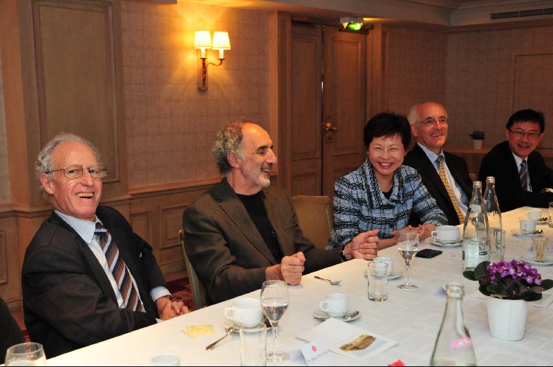 The Secretary for Development, Mrs Carrie Lam, has a lunch meeting with a group of French architects. On her right is Mr Paul Andreu, who designed the National Centre for the Performing Arts in Beijing.