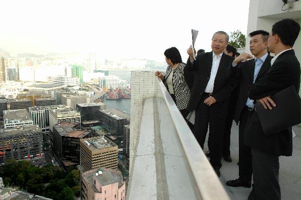 The Secretary for Housing, Planning and Lands, Mr Michael Suen, having a bird's eye view of the Hanoi Road Project under the Urban Renewal Authority.