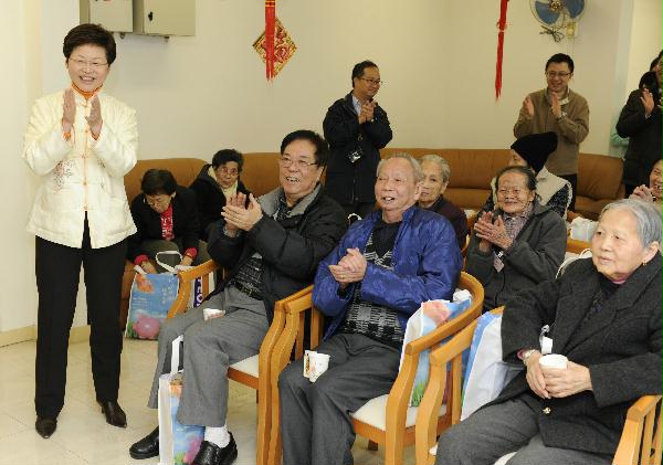 The Secretary for Development, Mrs Carrie Lam, participates in the New Year gathering organised for a group of elderly living in Tsz Ching Estate.