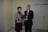 The Secretary for Development, Mrs Carrie Lam, presents a souvenir to Chief of Protocol, Tokyo Metropolitan Government Mr Toshiyuki Taga.