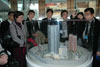 The delegation looks at a model of Roppongi Hills.