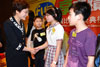 The Secretary for Development, Mrs Carrie Lam, chats with the award winners of the Historic Buildings Drawing Competition.