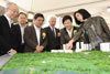 Mrs Carrie Lam views the model of the Integrated Elderly Community Project of the Hong Kong Housing Society in Tin Shui Wai Area 115.
