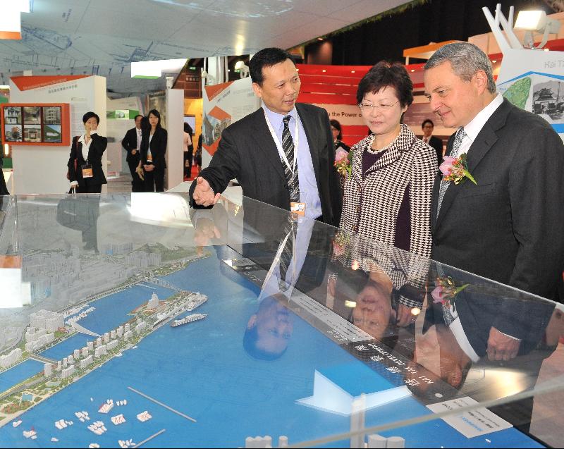 Mrs Carrie Lam is briefed on the Kai Tak Development while touring the Hong Kong Pavilion at MIPIM Asia 2010. The Hong Kong Pavilion features three main themes: Kai Tak Development, heritage conservation and urban renewal.