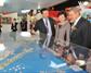 Mrs Carrie Lam views a model of the Kwun Tong Town Centre redevelopment project while touring the Hong Kong Pavilion at MIPIM Asia 2010.