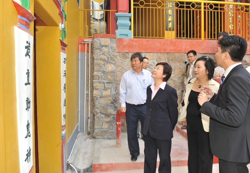 The Secretary for Development, Mrs Carrie Lam, inspects restoration work at the Tsing Shan Monastery.