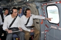 Mr Tsang (right), accompanied by the Permanent Secretary for Development (Works), Mr Wai Chi-sing, gets a bird's eye view of seven potential reclamation and two cavern sites across the territory.