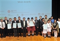 Mr Wai (sixth left) and Deputy Secretary for Development (Works), Ms Grace Lui (second right), with the Silver Award recipients.