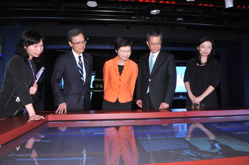 Mrs Lam (centre) tours the exhibition after the opening ceremony. (Image)