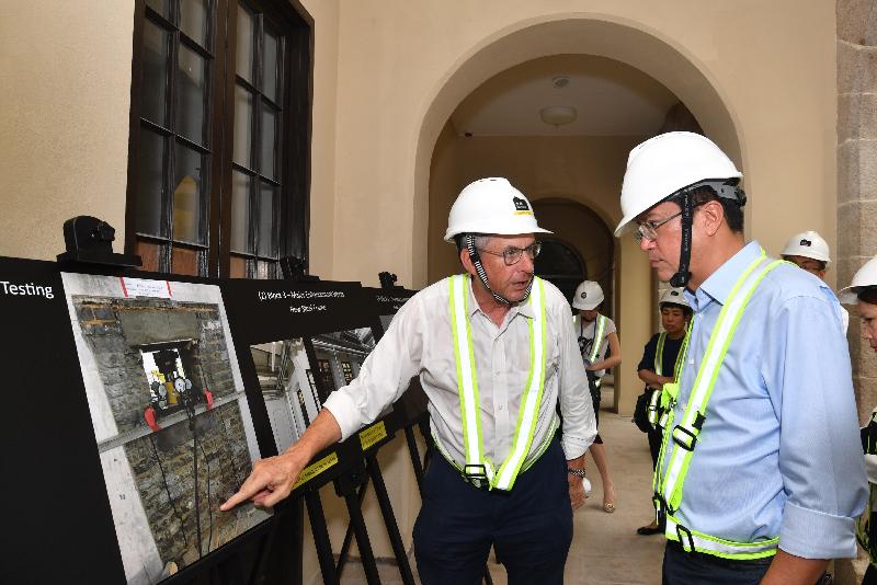 The Secretary for Development, Mr Michael Wong (right), visited Central and Western District today (August 29) to inspect the progress of works for the revitalisation of the Central Police Station Compound. Mr Wong was briefed by a representative of the Hong Kong Jockey Club on the condition of the Married Inspectors' Quarters and the proposed recovery plan.