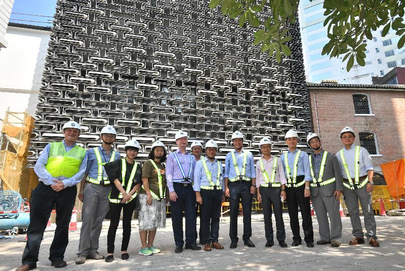 The Secretary for Development, Mr Michael Wong (fifth right), visited Central and Western District today (August 29) to inspect the progress of works for the revitalisation of the Central Police Station Compound. Accompanied by the Chairman of the Central and Western District Council, Mr Yip Wing-shing (sixth right), and the District Officer (Central and Western), Mrs Susanne Wong (third left), Mr Wong visited the new buildings of the revitalisation project and is pictured with representatives of the Development Bureau, Hong Kong Jockey Club and Tai Kwun in front of the building which will be used as a multi-purpose auditorium. 