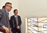 The Secretary for Development, Mr Michael Wong, visited Yau Tsim Mong District today (December 11) to see the preservation and revitalisation project at Prince Edward Road West and Yuen Ngai Street. Photo shows Mr Wong (right) being briefed by the General Manager (Planning & Design) of the Urban Renewal Authority, Mr Lawrence Mak (left), on the preservation of one of the key architectural features of a shophouse - the windows.