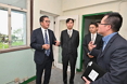 The Secretary for Development, Mr Michael Wong, visited the former Lau Fau Shan Police Station revitalisation project during his visit to Yuen Long District today (October 25). Photo shows Mr Wong (first left) being briefed by the Commissioner for Heritage, Mr Jose Yam (first right), on the plan for the restoration and revitalisation of the former Lau Fau Shan Police Station. Looking on are the Chairman of the Yuen Long District Council, Mr Shum Ho-kit (second left), and the District Officer (Yuen Long), Mr Enoch Yuen (second right).