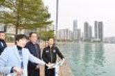 The Secretary for Development, Mr Michael Wong (second right), visited Tsuen Wan District today (December 14) to learn more about the enhancement works to be carried out at the Tsuen Wan Promenade. Accompanying Mr Wong are the District Officer (Tsuen Wan), Miss Jenny Yip (left), and member of Tsuen Wan District Council Mr Koo Yeung-pong (first right).
