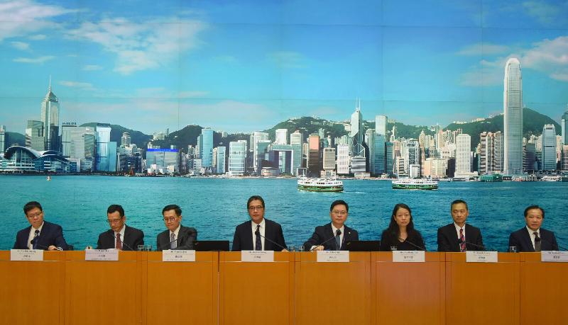 The Secretary for Development, Mr Michael Wong (fourth left), hosted a press conference today (October 11) on the enhancement of building safety and rehabilitation subsidy schemes. Also present were the Deputy Secretary for Development (Planning and Lands), Mr Maurice Loo (third left); the Director of Electrical and Mechanical Services, Mr Alfred Sit (fourth right); the Deputy Secretary for Security, Mrs Apollonia Liu (third right); the Deputy Director of Fire Services, Mr Joseph Leung (second right); the Deputy Director of Buildings, Mr Yu Tak-cheung (first left); the Director (Building Rehabilitation) of the Urban Renewal Authority, Mr Daniel Ho (second left); and the Assistant Director (Property Management) of the Hong Kong Housing Society, Mr Sanford Poon (first right).