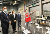 Photo shows the Secretary for Development, Mr Michael Wong (first left), and the Deputy Director of the Bureau of Public Works of Shenzhen Municipality, Mr Li Zhuo (second left), inspecting the medical station of the community treatment facility expansion at AsiaWorld-Expo today (October 9).