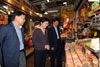 The Secretary for Development, Mrs Carrie Lam (centre), visiting a dried-food stall during her visit to Lau Fau Shan today (March 19). Accompanying Mrs Lam are Yuen Long District Officer, Mr Yeung Tak-keung (right) and Yuen Long District Council Chairman Mr Leung Che-cheung (left).