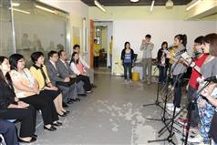 The Secretary for Development, Mrs Carrie Lam, visits the Choi Wan Rhenish Integrated Children and Youth Services Centre in Choi Wan Estate and enjoys the singing performance by a group of youngsters.