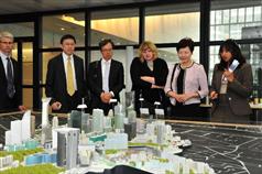 Mrs Lam (second right) is briefed on the latest development of the La Défense business district.