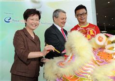 Mrs Lam and Mr Zilk dot the eyes of the lion for the lion dance.
