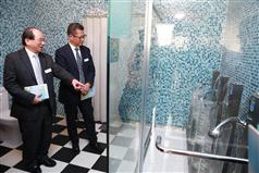 Mr Chan (right) and Mr Ma visit the Water-saving Device Showroom in the Water Resources Education Centre. 