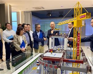 The Secretary for Development, Ms Bernadette Linn, today (April 24) visited Jiangmen and Zhuhai to inspect the operation and development of the Modular Integrated Construction (MiC) manufacturing bases in the area. Photo shows Ms Linn (second left); the Permanent Secretary for Development (Works), Mr Ricky Lau (fourth right); the Under Secretary for Development, Mr David Lam (third left); and the Head of the Project Strategy and Governance Office, Mr John Kwong (first left), being briefed on the MiC model during their inspection of the manufacturing base of China State Construction Hailong Technology Company Limited in Zhuhai.