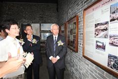 Touring the Kowloon Walled City Park, Mrs Lam is briefed on the park design. 