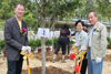 The Deputy Secretary for Development (Works), Mrs Jessie Ting, the Director of Drainage Services, Mr Chan Chi-chiu (left), and the Chairman of Tai Po District Council, Mr Cheung Hok-ming (first right) plant trees around Ma Wat River at a ceremony today (April 9).